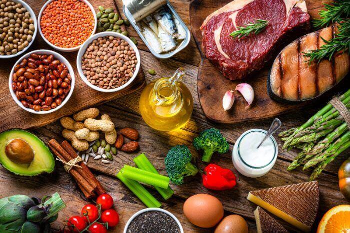 Healthy food including nuts, meat, and vegetables by Arizona Vein & Laser Institute