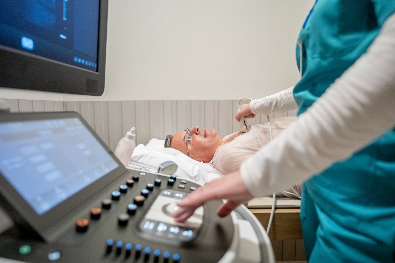 A man receiving a vascular ultrasound by a doctor by Arizona Vein & Laser Institute